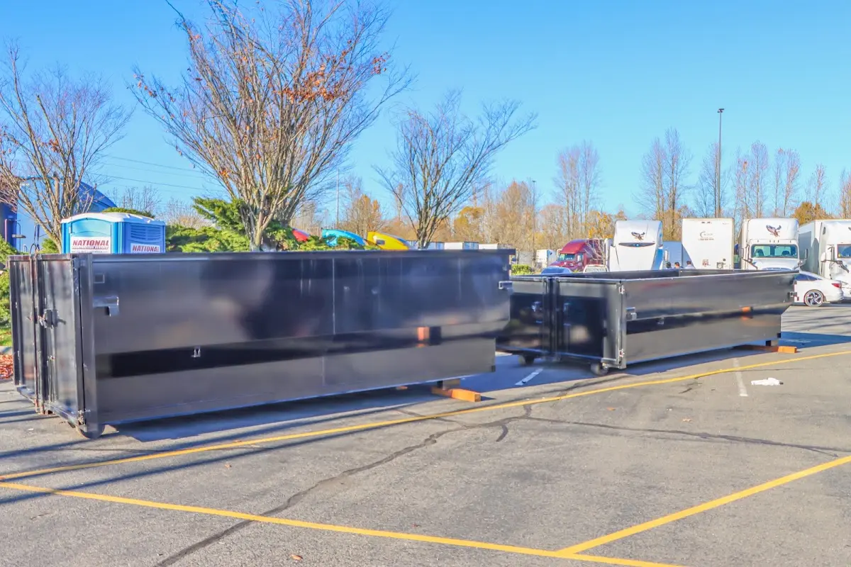 Professional dumpster rental service with roll-off container on residential driveway in Yucaipa